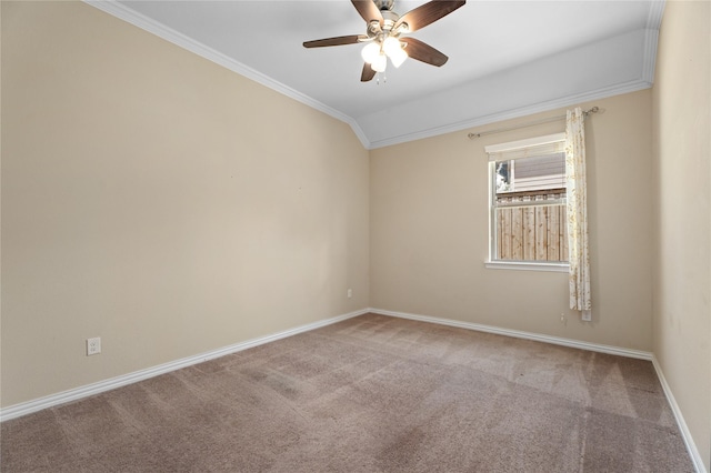 spare room with vaulted ceiling, ornamental molding, ceiling fan, and carpet flooring