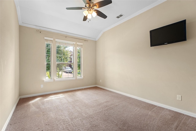 unfurnished room with vaulted ceiling, ornamental molding, ceiling fan, and carpet flooring