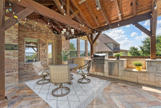 view of patio / terrace featuring a gazebo, area for grilling, and grilling area