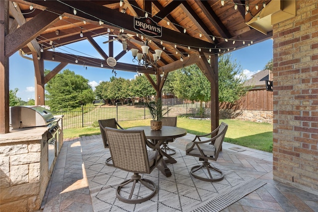 view of patio featuring area for grilling, a gazebo, grilling area, and ceiling fan