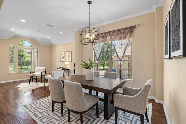 dining room with dark wood-type flooring and ornamental molding