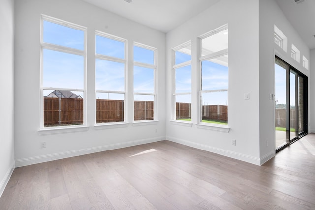 unfurnished sunroom featuring a wealth of natural light