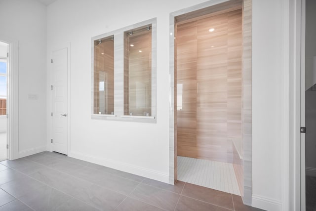 interior space featuring baseboards and tile patterned floors