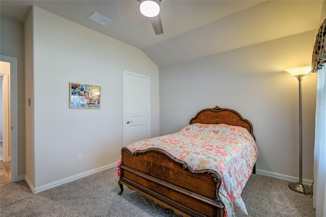 bedroom with ceiling fan, lofted ceiling, and carpet