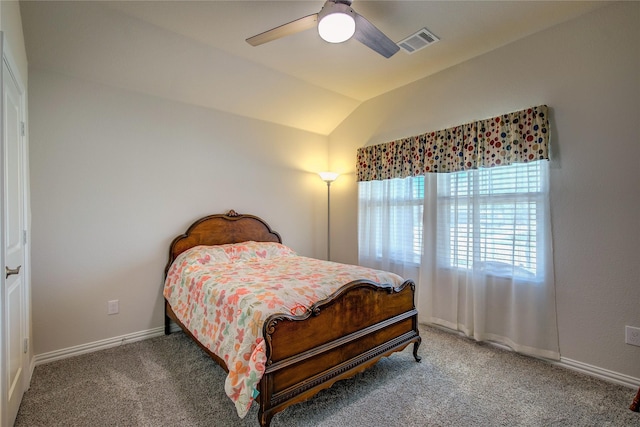 carpeted bedroom featuring vaulted ceiling and ceiling fan