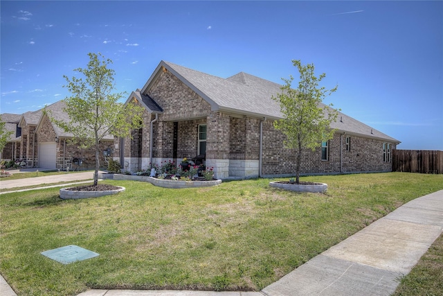 view of side of home with a yard