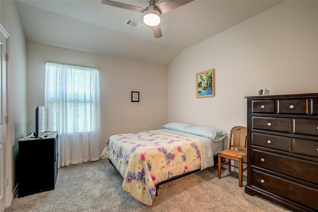 carpeted bedroom with lofted ceiling and ceiling fan