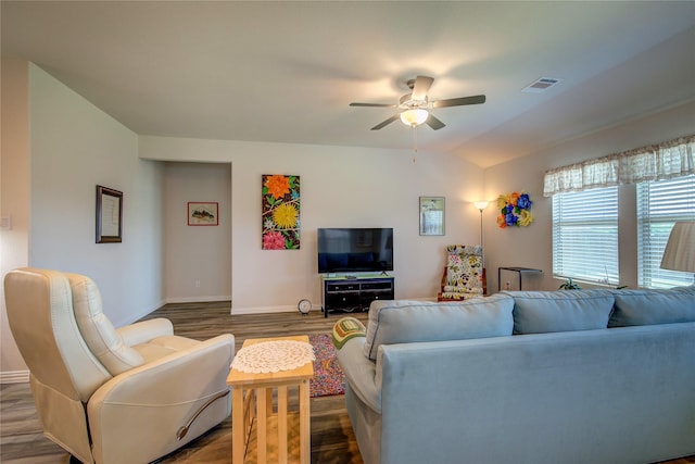 living room with wood-type flooring, lofted ceiling, and ceiling fan