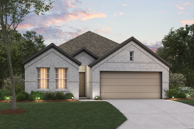 french country inspired facade featuring a garage, concrete driveway, brick siding, and a shingled roof