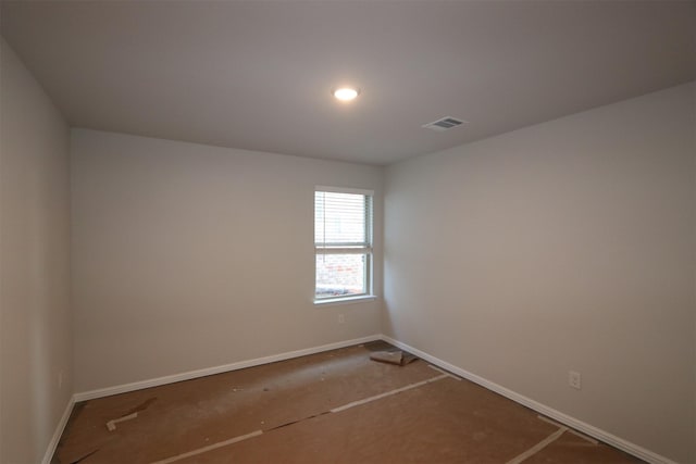 empty room with baseboards and visible vents