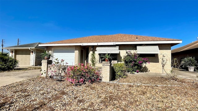 ranch-style home featuring a garage