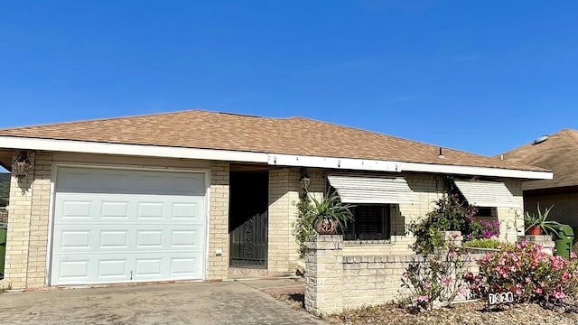 single story home with a garage