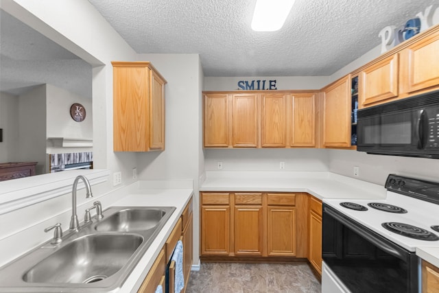 kitchen featuring sink, electric range, and a textured ceiling