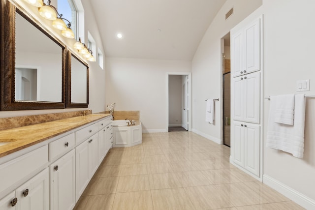 bathroom featuring vanity and separate shower and tub