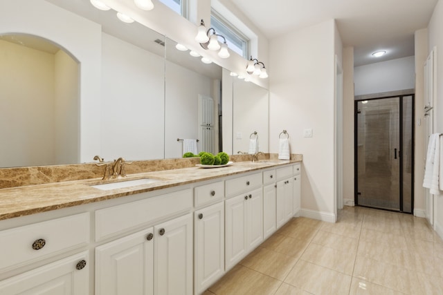 bathroom with vanity, tile patterned floors, and walk in shower