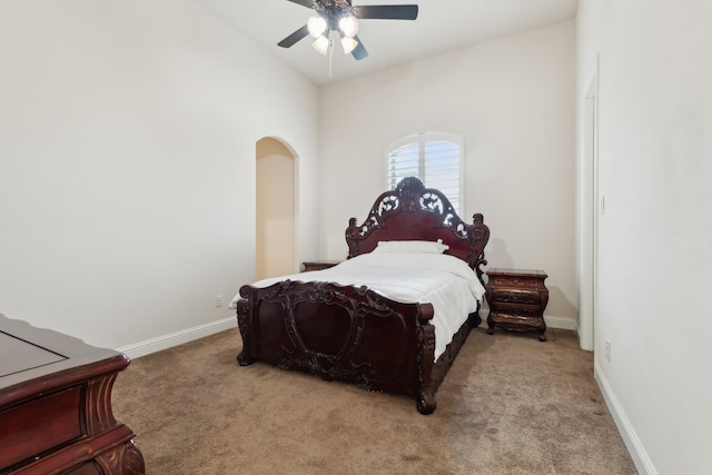 carpeted bedroom featuring vaulted ceiling and ceiling fan