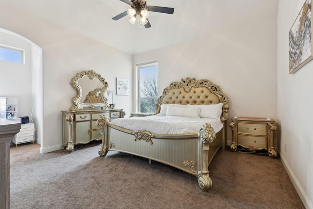 bedroom with dark colored carpet and ceiling fan