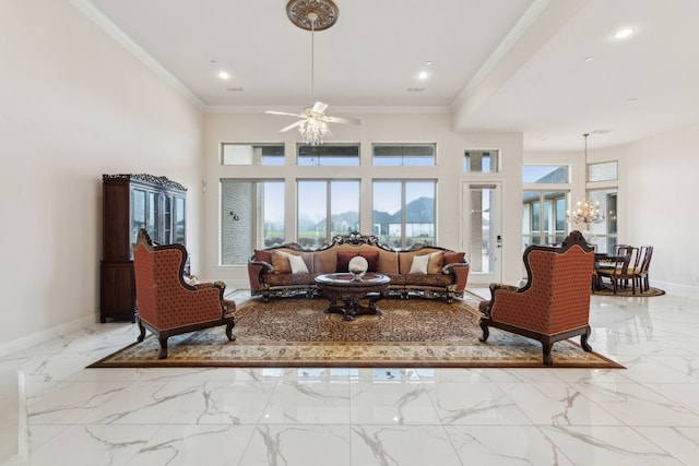 living room featuring ceiling fan with notable chandelier, ornamental molding, and a towering ceiling