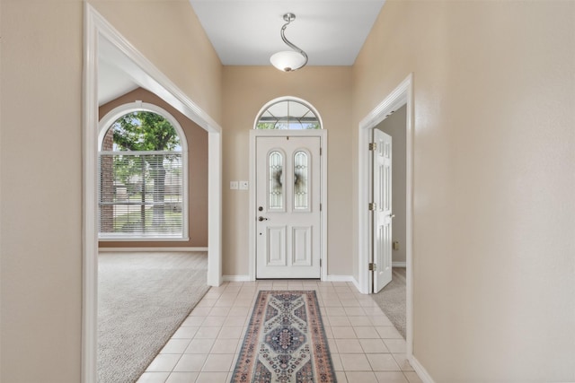 entrance foyer featuring light carpet