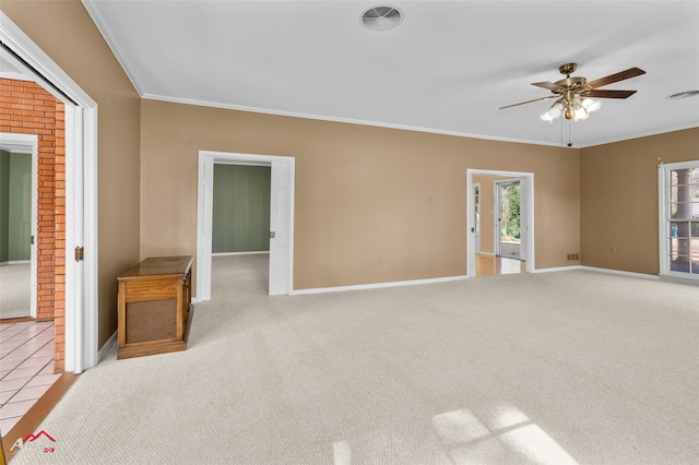 interior space with crown molding, ceiling fan, and a healthy amount of sunlight