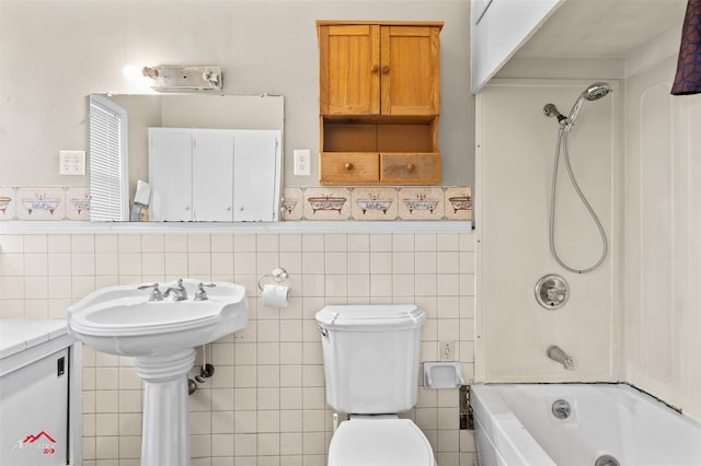 bathroom featuring tile walls,  shower combination, and toilet