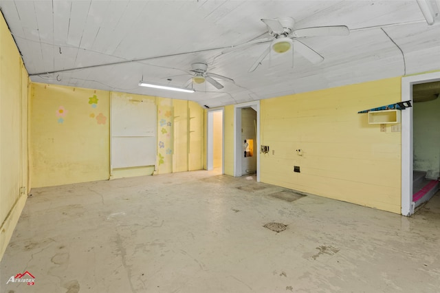 interior space with ceiling fan and concrete floors