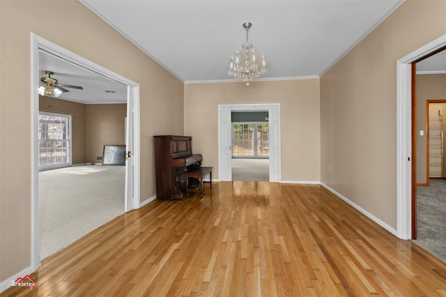 unfurnished dining area with light hardwood / wood-style flooring, a wealth of natural light, and ornamental molding