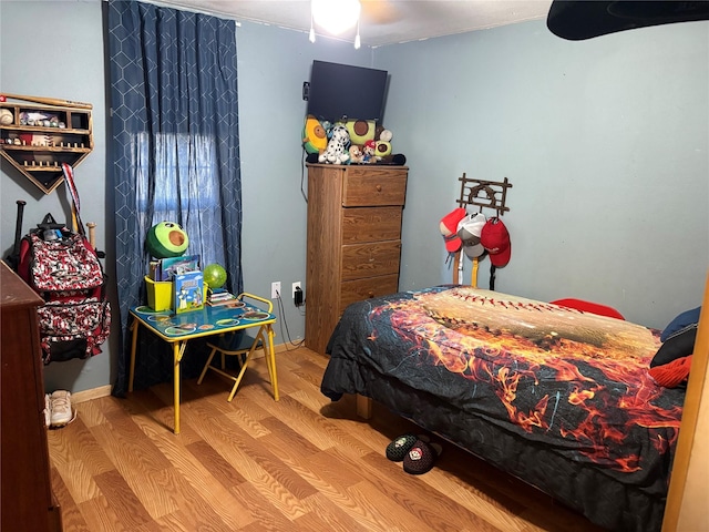 bedroom featuring hardwood / wood-style flooring