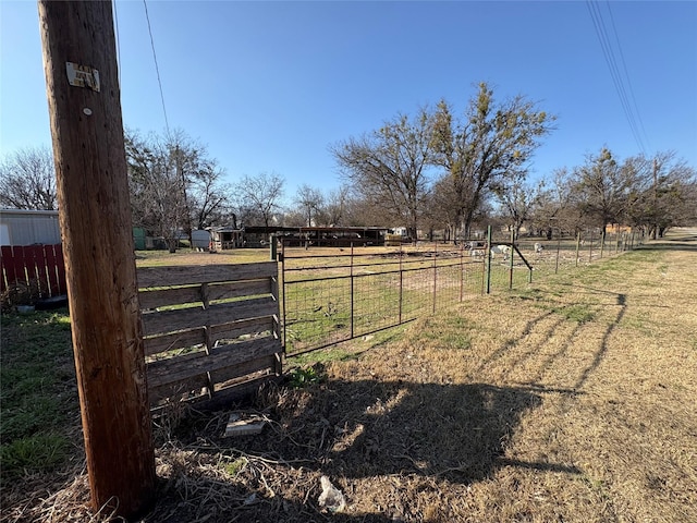 view of yard with a rural view