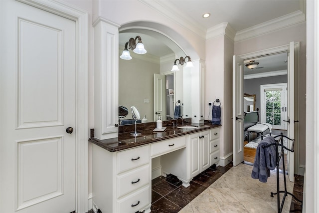 bathroom featuring vanity and ornamental molding
