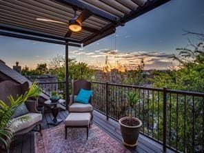 view of balcony at dusk