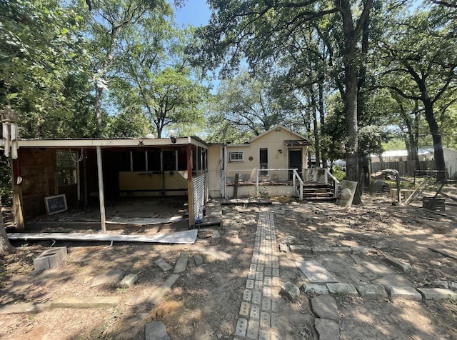 back of house with a wooden deck