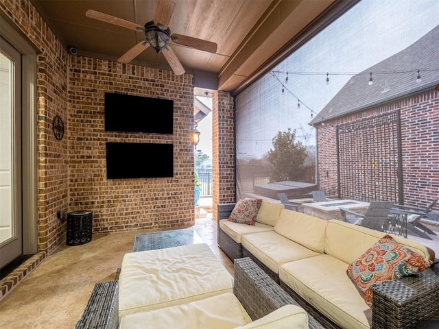 view of patio with outdoor lounge area and ceiling fan