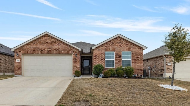 view of front facade with a front yard and a garage