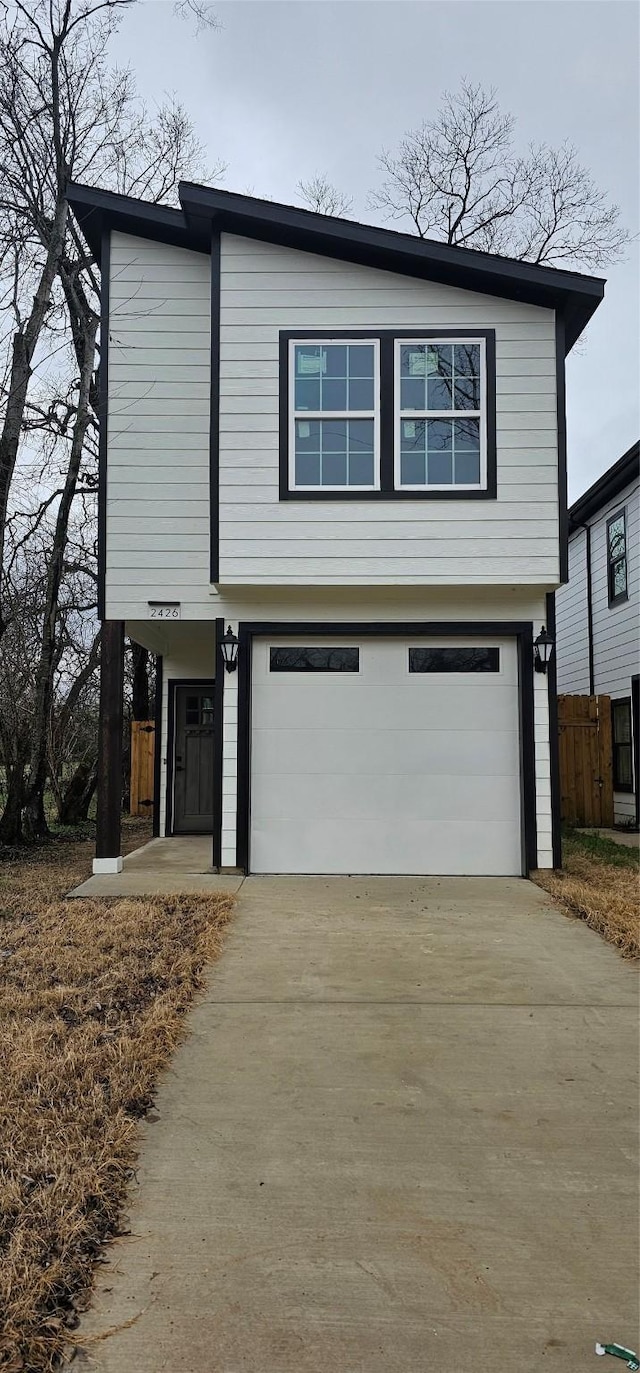 front of property with a garage