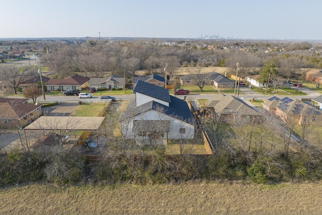 birds eye view of property with a residential view
