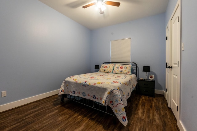 bedroom with dark wood finished floors, baseboards, and ceiling fan