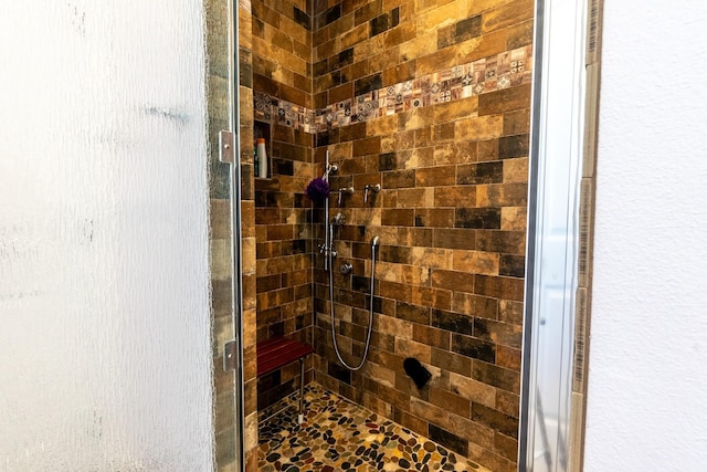 bathroom with a shower stall