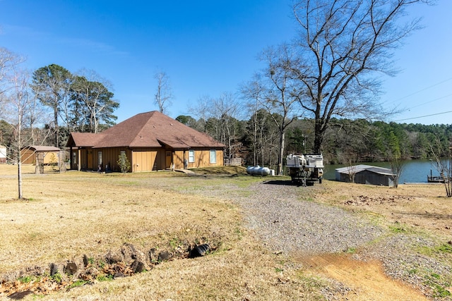 view of front of home with board and batten siding and a water view