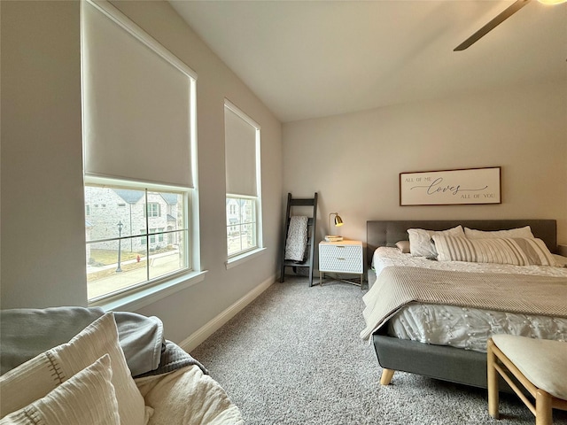 carpeted bedroom featuring baseboards