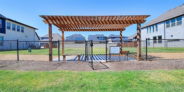 view of play area with a residential view, a pergola, and a yard