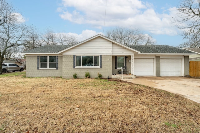 ranch-style home featuring a garage and a front yard