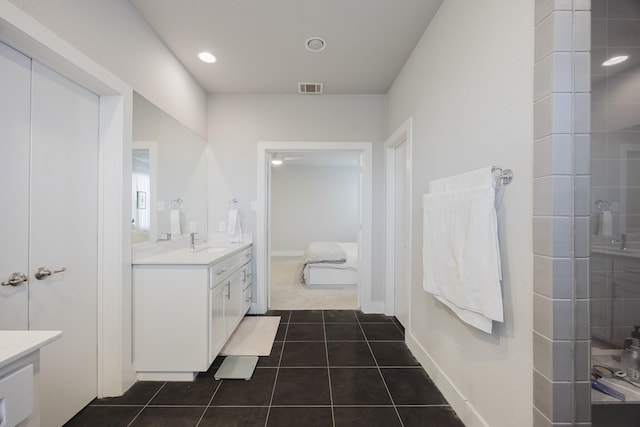 bathroom with tile patterned flooring, walk in shower, vanity, visible vents, and ensuite bath