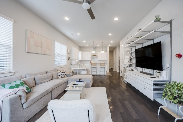 living room with ceiling fan, dark wood-style flooring, and recessed lighting