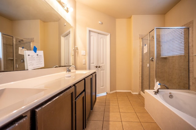 bathroom with independent shower and bath, vanity, and tile patterned floors