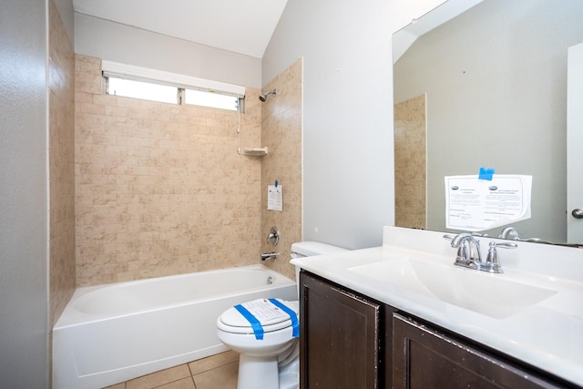 full bathroom with vanity, tiled shower / bath combo, tile patterned floors, and toilet