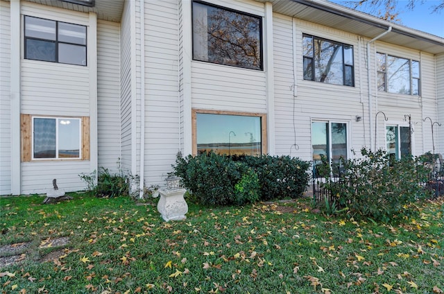 view of side of home featuring a yard