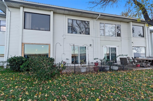 rear view of house with a yard and a patio area