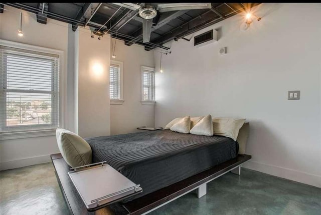 bedroom with concrete flooring