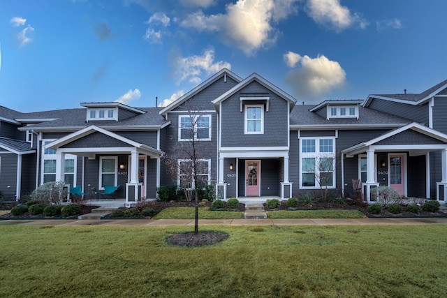 craftsman-style home with a front yard